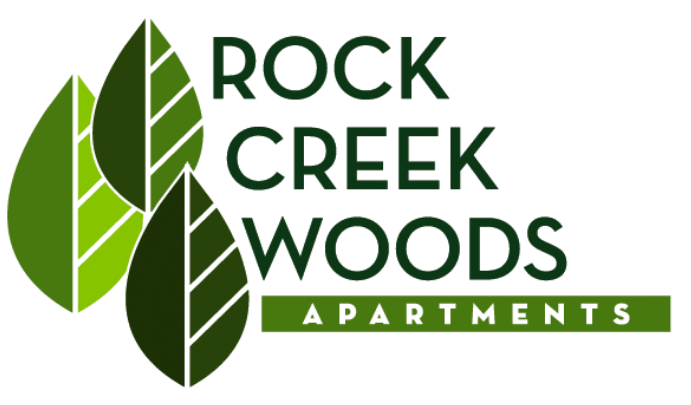 The image is a logo for Rock Creek Woods Apartments.